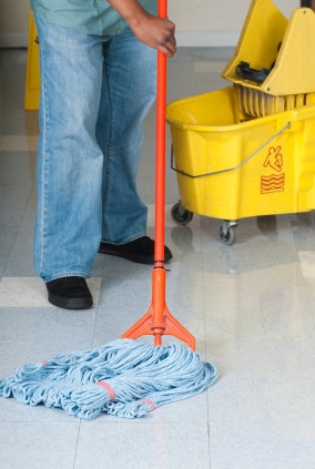 Wonderworker Cleaning LLC janitor in Oklahoma City, OK mopping floor.